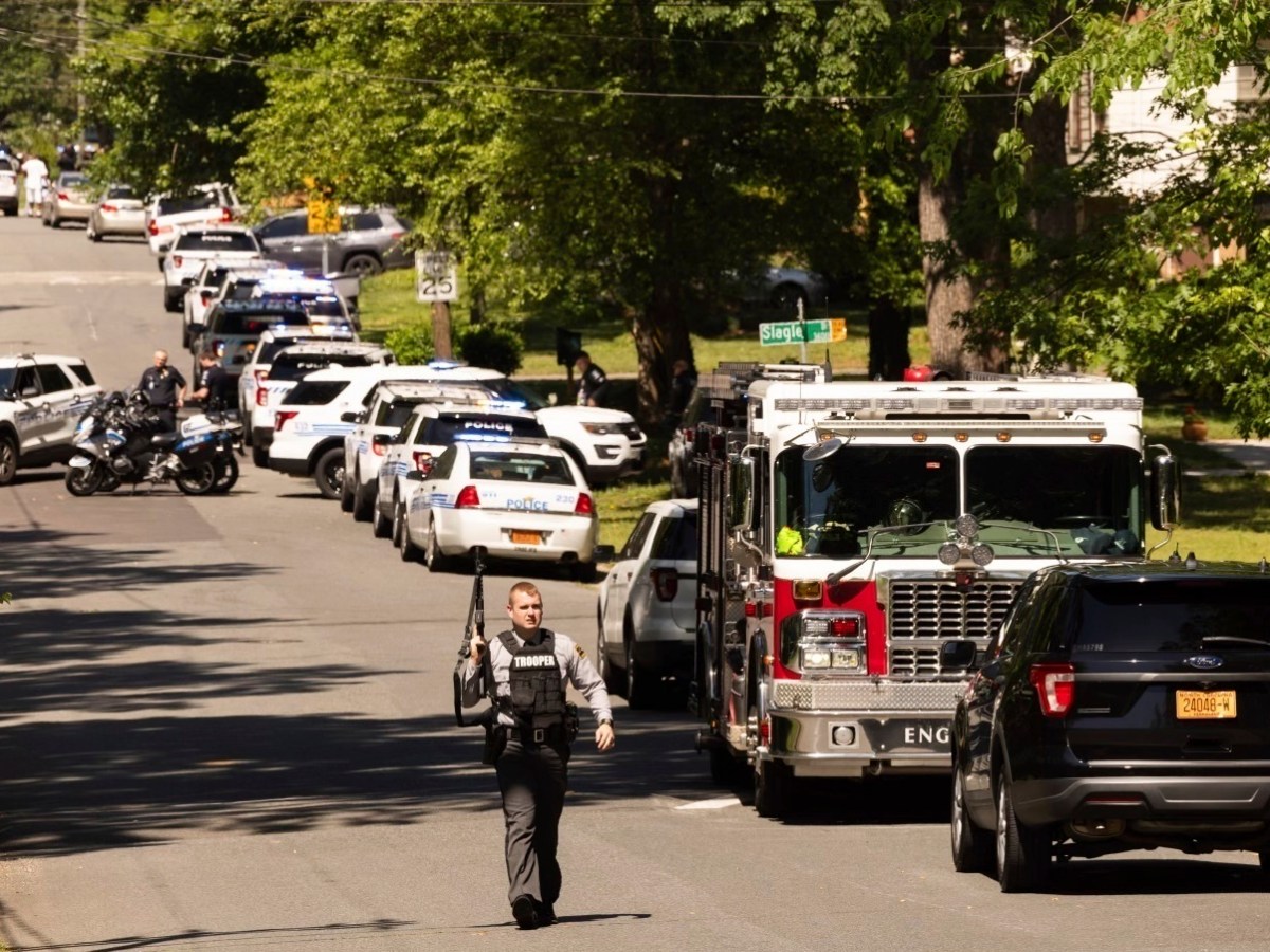 Law enforcement vehicles respond to the April 29 shooting in Charlotte