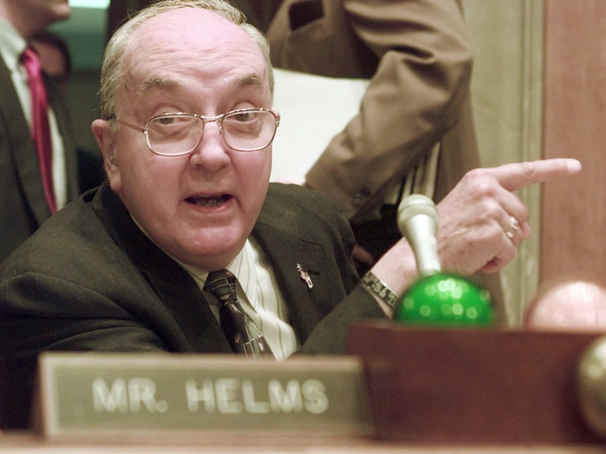 Sen. Jesse Helms points while making comments at the end of a hearing in 1997.