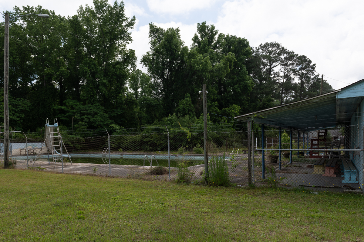 an abandoned pool with sliding board