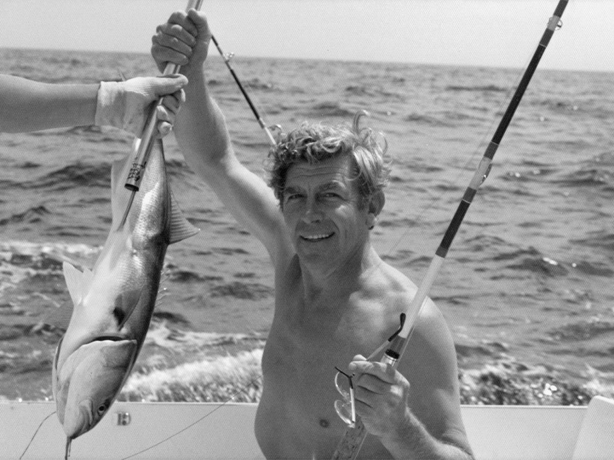 Andy Griffith holding a fish in Manteo